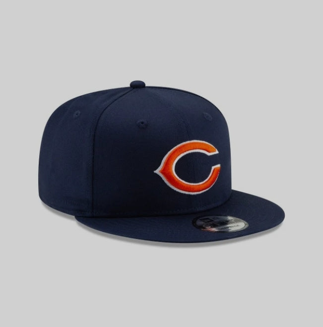 Navy blue NEW ERA Chicago Bears Basic 9FIFTY Snapback hat with orange and white logo.