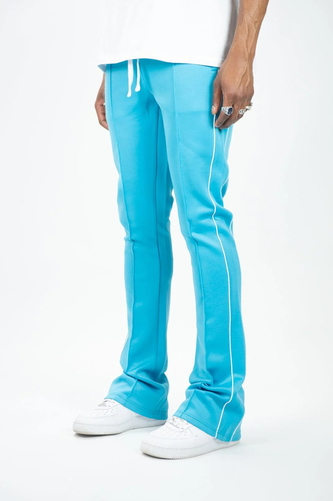 Rebel Minds / Ringspun blue track pants with white side stripes and drawstring waistband.