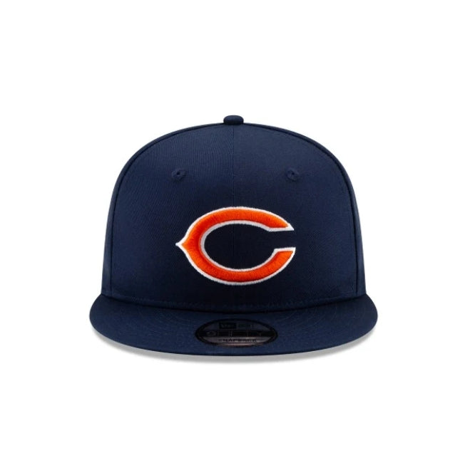 Navy blue NEW ERA Chicago Bears 9FIFTY snapback hat with orange and white 'C' logo.